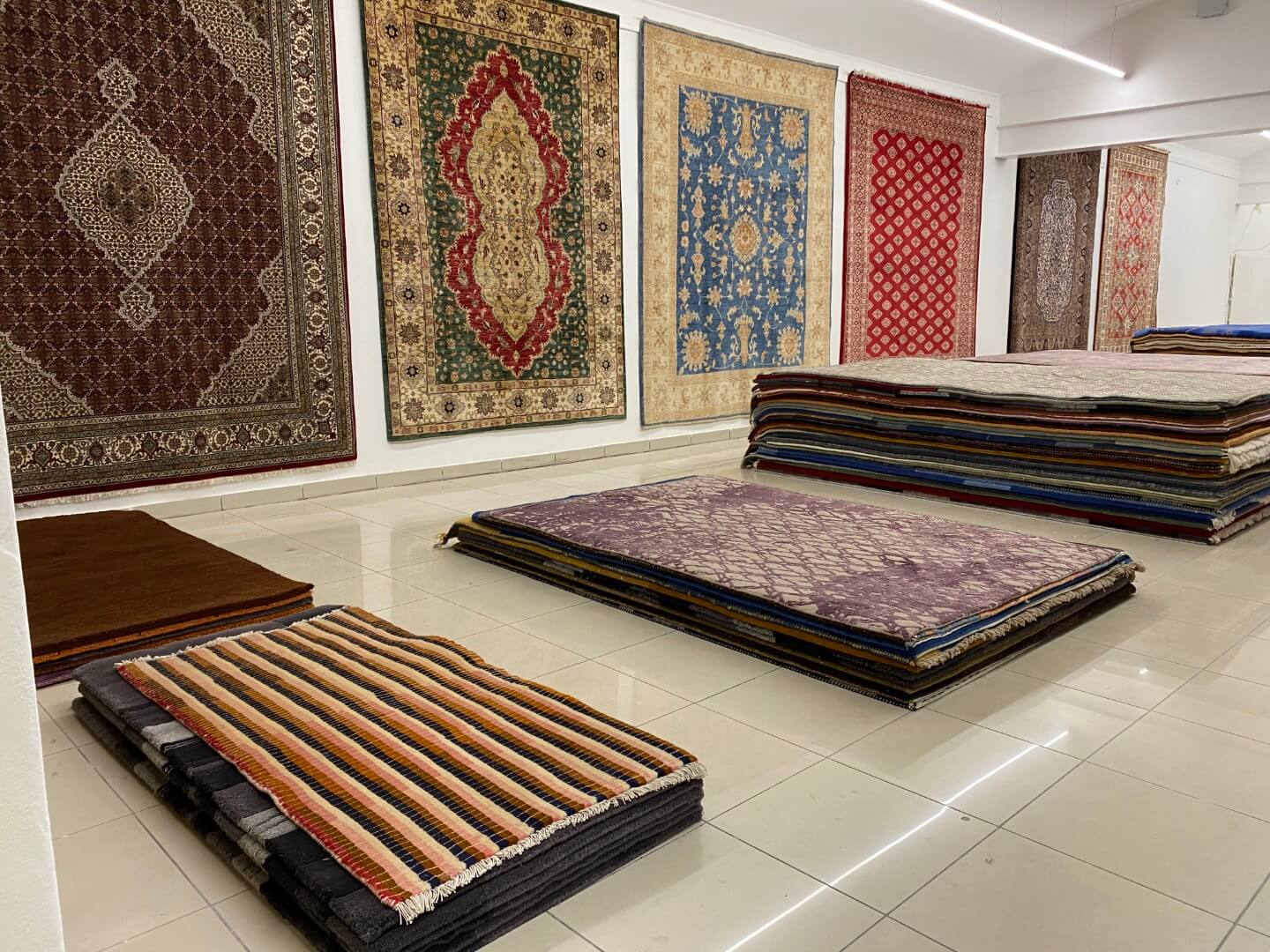 Hand-knotted rugs in many sizes displayed in Carpeteria's spacious Prague showroom