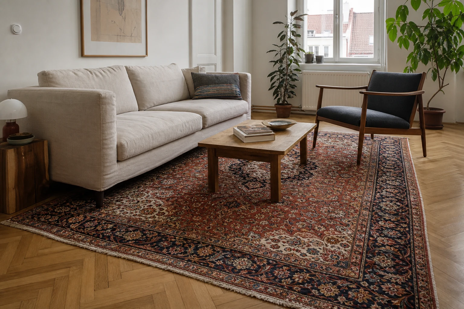 A traditional hand-knotted Persian rug with medallion and border in a simple contemporary living room